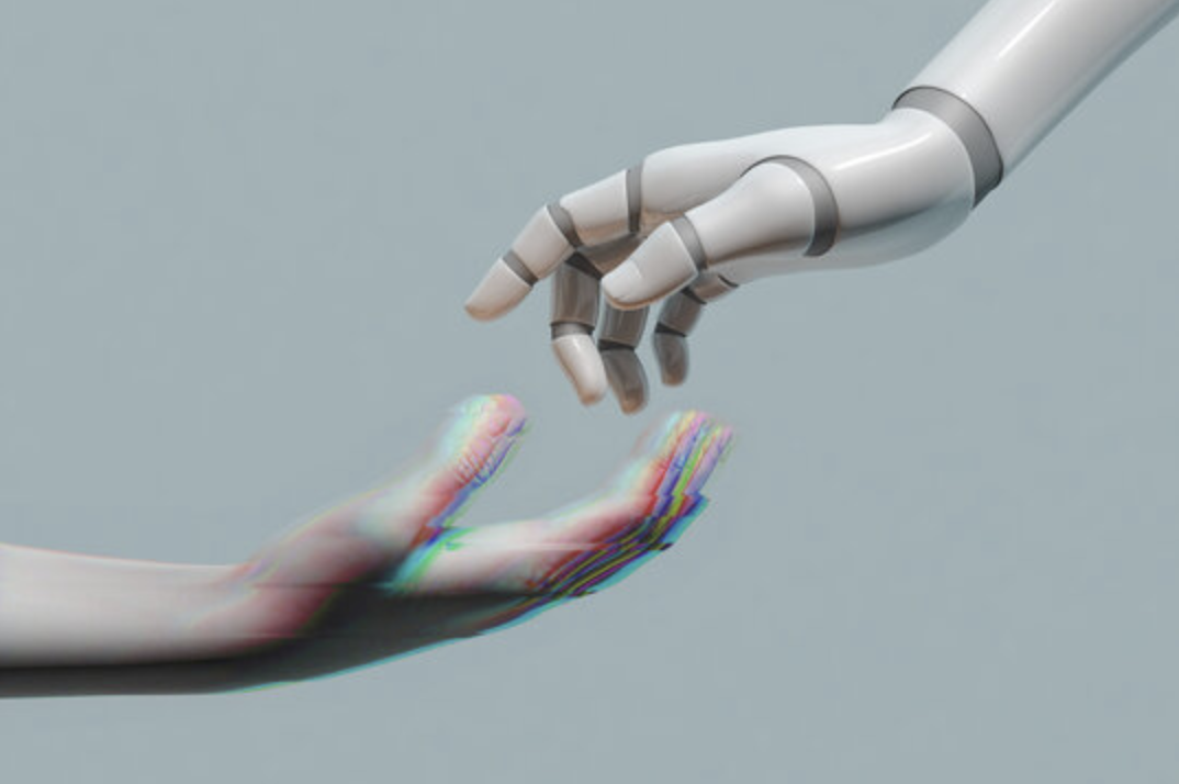A robotic hand reaching toward a human hand, symbolising the intersection of technology and people
